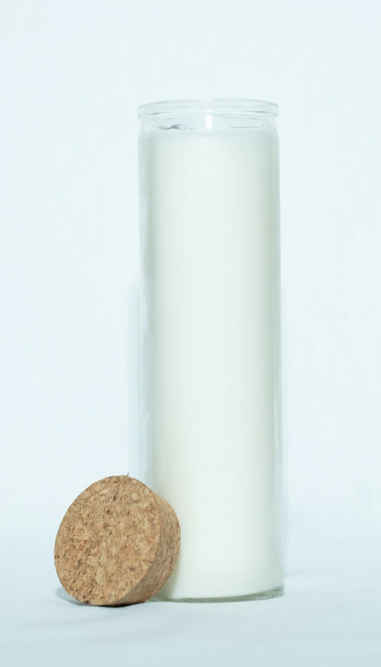 Glass candle with cork base on a white background