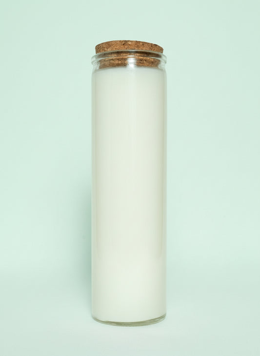 Candle in a glass jar with a cork lid on a white background